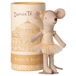 A Maileg Ballet Dancer Mouse, Big Sister, poses gracefully in front of a cylindrical "Dance The Romeo & Juliet" box with a building illustration—ideal for display.