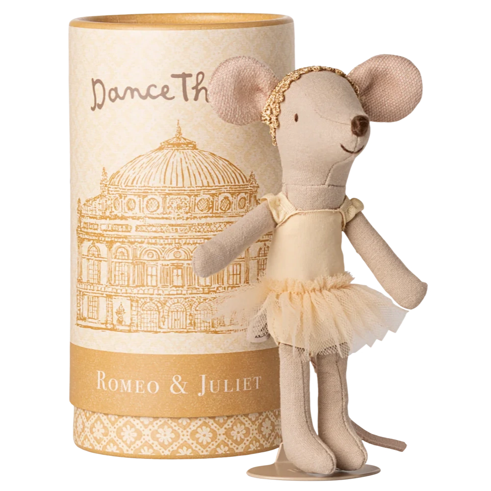 A Maileg Ballet Dancer Mouse, Big Sister, poses gracefully in front of a cylindrical "Dance The Romeo & Juliet" box with a building illustration—ideal for display.