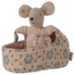 The Maileg Baby Mouse in Carry Cot - Rose features a tiny mouse in a pink outfit nestled in a floral-patterned carry cot.