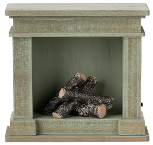 The Maileg Fireplace, Miniature - Dusty Green features a vintage finish and four faux birch logs inside—an ideal touch of charm for any miniature home.