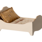 The Maileg Bed, Mouse - Off White is a small cream wooden dollhouse bed with floral mattress and pillow, perfect as a cozy bed for mice or tiny toys.