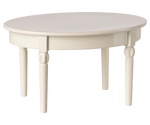 The Maileg Vintage Dining Table, Mouse - Off White, is a round, white wooden table with four legs—ideal as dollhouse furniture—shown against a plain background.