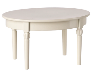 The Maileg Vintage Dining Table, Mouse - Off White, is a round, white wooden table with four legs—ideal as dollhouse furniture—shown against a plain background.