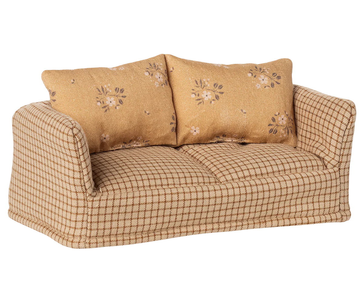 The Maileg Couch, Mouse - Mable is a small patterned sofa with two floral cushions and beige-brown checkered fabric—ideal for a cozy mice family home.