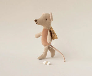 Maileg Fairy Mouse, Little - Rose stands upright with a soft pink dress, delicate wings, a long tail, and is accessorized with a small yellow backpack and a brown vest, plus a tag attached to its hand.