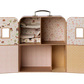The Maileg SuitCasa for Little Sister and Brother Mouse is a charming dollhouse-style suitcase featuring four compartments, shelves with neatly folded linens, and interior walls adorned with pastel patterns and tiny windows on the doors—offering the perfect portable house for your little mice, complete with plenty of space to arrange their small furniture.