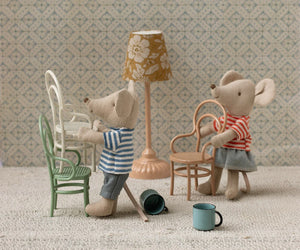 Two Maileg Vintage Chairs (Dark Powder) provide charming seating for toy mice or a unique dollhouse accent, complete with mugs and a lamp set against patterned wallpaper.