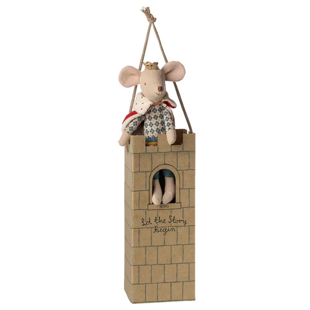 A Maileg King Mouse, Dad, dressed regally, sits in a cardboard castle tower with "Let the story begin" written on it and hangs by a string.