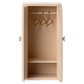 A petite beige wooden "Closet - Mouse" by Maileg features double doors that open to reveal three gold hangers and a bottom shelf—an enchanting addition to any dollhouse or the perfect elegant closet for mice.