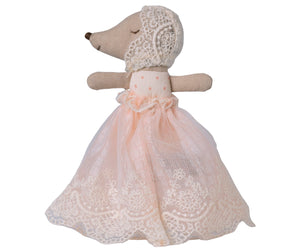 Maileg’s Baby Mouse in Powder Gown, dressed in a lace bonnet and a long powder pink lace dress, is shown in profile against a white background.