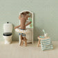 Beach Mouse with Yellow Dot Float - Little Brother by Maileg relaxes at the dollhouse vanity, dressed in playful swim trunks and his cheerful yellow dot float. With bunny ears perked up, he sits beside the toilet and a stool draped with a striped towel and cup—ready for any adventure, whether it’s bath time fun or imaginative beach play.