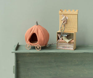 Maileg’s Pumpkin Carriage - Mouse, paired with a fabric castle play set and complete with a plush mouse, ladder, and stacked mattresses, displayed on a green wooden surface against a light green wall.