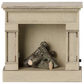 A compact, off white wooden fireplace model by Maileg, featuring decorative logs inside, perfect for adding a vintage touch to your miniature home.