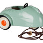 A small Light Mint Car - Mouse by Maileg in mint-green, featuring a red and white wheel, black steering wheel, and a brown pull string with an attached metal tag.