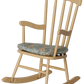 The Maileg Rocking Chair, Mouse - Wheat is a beige farmhouse-style wooden rocking chair featuring a padded, patterned fabric seat cushion for a comfortable and inviting look, shown isolated on a white background.