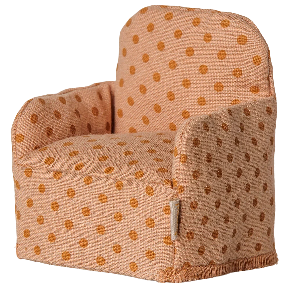 The Maileg Folding Chair, Mouse - Dots, is a small upholstered chair with orange polka dots on light orange fabric, perfect for the Mouse hole Farmhouse or as a cozy seat for your little Maileg friends, shown isolated on a white background.