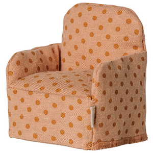 The Maileg Folding Chair, Mouse - Dots, is a small upholstered chair with orange polka dots on light orange fabric, perfect for the Mouse hole Farmhouse or as a cozy seat for your little Maileg friends, shown isolated on a white background.