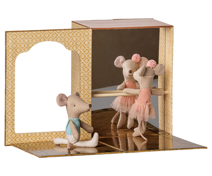 The Maileg Ballet Mice in Dance Studio—featuring little sister and brother mice dressed in delightful ballet costumes, with one posed at the barre and the other seated on the floor—practice together in a whimsical miniature studio adorned with mirrors and patterned walls, making a magical addition to any ballet playset or mouse house.
