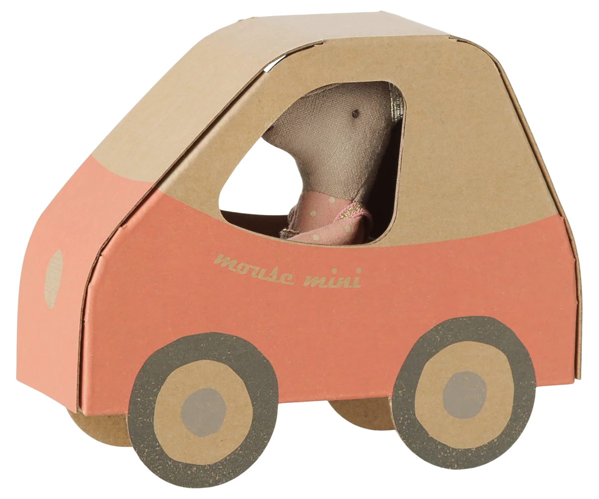 A Maileg Driver Mouse, Little Sister sits inside a charming car with red sides and large round wheels.