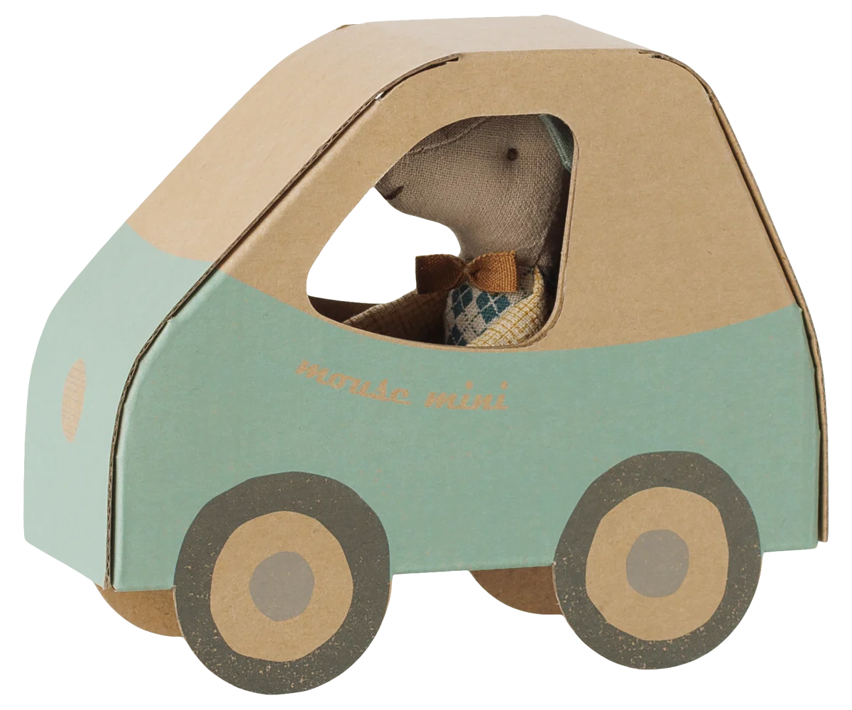 A Maileg Driver Mouse, Little Brother sits inside a blue and brown cardboard mouse car with round wheels.