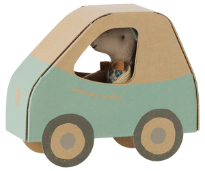 A Maileg Driver Mouse, Little Brother sits inside a blue and brown cardboard mouse car with round wheels.