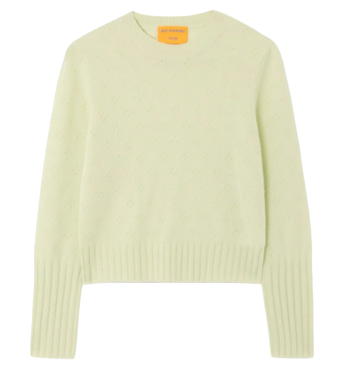 The Compass Shrunken Crew by Guest in Residence is a light yellow women’s slim-fit sweater in a lightweight popcorn stitch, featuring long sleeves with ribbed cuffs and hem, shown laid flat on a white background.