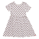 Girls’ Sunny Dress by Coop Kids PC: This versatile dress showcases a white short-sleeve design with a fitted waist and an all-over purple floral pattern, crafted from soft organic Pima cotton, and is displayed on a plain white background.