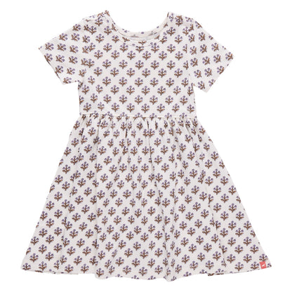Girls’ Sunny Dress by Coop Kids PC: This versatile dress showcases a white short-sleeve design with a fitted waist and an all-over purple floral pattern, crafted from soft organic Pima cotton, and is displayed on a plain white background.