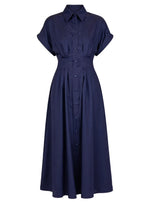 The Corsica Dress by Callas Milano is a navy blue, short-sleeve, fit and flare midi dress in cotton twill with a collared neckline, button-down front, and fitted waist.