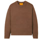 The Guest in Residence Cozy Crew Cashmere Sweater, in a brown knit with ribbed neck trim, cuffs, and hem, showcases a chic dropped shoulder design and is displayed on a white background.