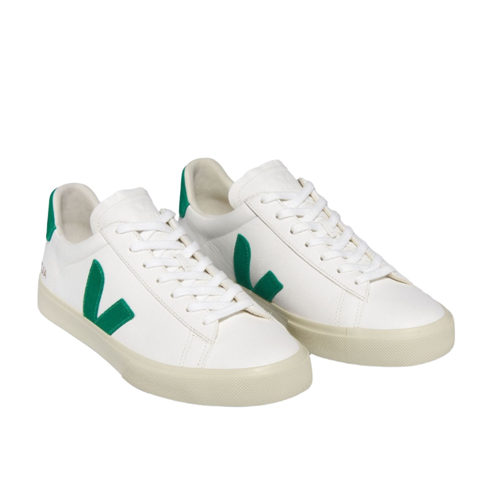 The VEJA Campo Leather Women's Sneakers from Veja feature white ChromeFree leather, green V-shaped logos on the sides, white laces, and light-colored soles. Made in Brazil, they offer both style and sustainability.