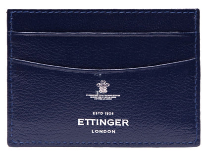 Ettinger Capra Flat Credit Card Case in blue from Ettinger's collection, featuring multiple slots and crafted from premium goat leather. It bears the inscription: "BY APPOINTMENT TO HRH THE PRINCE OF WALES MANUFACTURERS OF LEATHER GOODS ETTINGER (LONDON) LTD ESTD 1934." Ideal as a credit card holder.