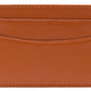The Ettinger Capra Flat Credit Card Case is crafted from brown goat leather in a minimalist design, featuring two horizontal card slots for easy access.