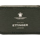 The Capra Magnetic Cash Clip by Ettinger is a luxurious green goat leather accessory with an embossed Ettinger London logo, featuring a discreet magnetic money clip for added elegance.