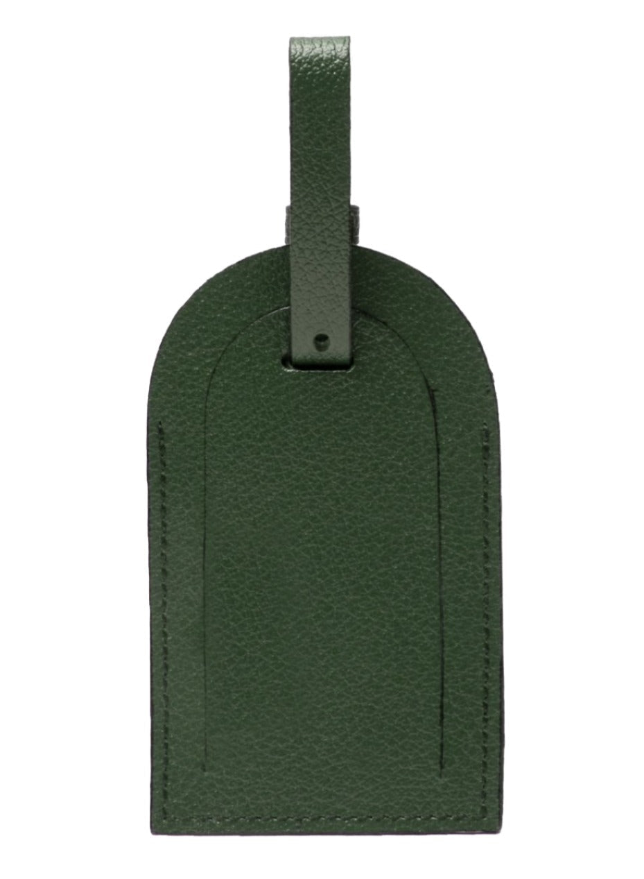 An Ettinger Capra Collection luggage tag in green goat leather has a stitched border and sturdy strap for secure attachment, set against a plain white background.