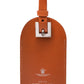 Brown goat leather luggage tag from the Capra Collection, featuring a buckle strap and "Ettinger" embossed at the bottom with a logo above.