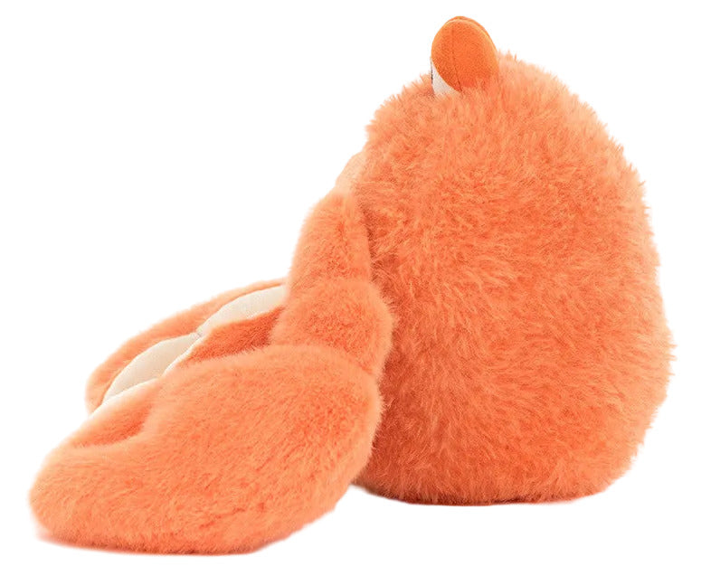 The Jellycat Pinchsnap Crab, a soft, orange stuffed animal with floppy ears, is shown facing away on a white background.