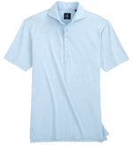 The Johnnie-O Idris Polo is a light blue, short-sleeve shirt made from lightweight, moisture-wicking fabric, featuring a collar and three white buttons.