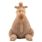 The Jellycat Richie Dromedary, a plush camel toy from Jellycat, sits facing away to reveal its sandy-textured back and squeezable hump.