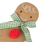 Close-up of the Meri Meri Gingerbread Man Card featuring a gingerbread man with a green and white checkered ribbon bow and a red pompom button on its chest, perfect for adding charm to any festive design.