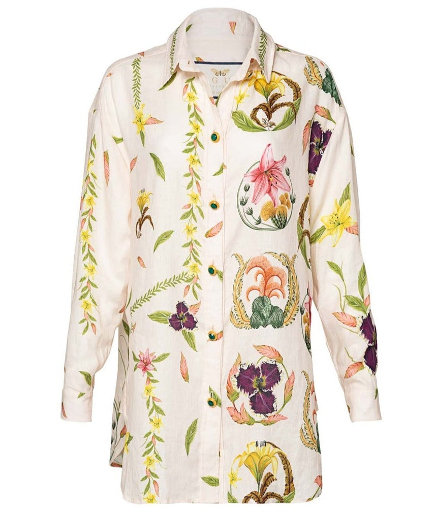 A women's long-sleeve linen shirt with a colorful botanical and floral print on a white background.
Product Name: Agua by Aguabendita Cecilia Shirt
Brand Name: Agua By Aguabendita