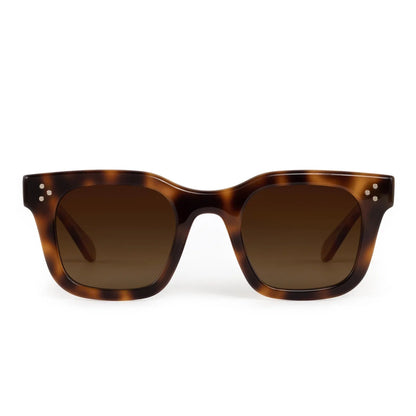 Front view of Krewe's Celeste Polarized Sunglasses showcasing a classic tortoiseshell frame, brown gradient lenses, and three silver dots on each upper corner.