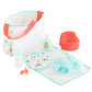 The Corolle Baby Doll Changing Bag + Accessories set by Corolle includes a delightful pastel tote bag, bottle, bib, diaper, lotion, training potty, and pacifier—perfect for your little one's essentials.