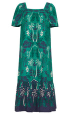 Introducing the Cara Cara Chani Dress, a bohemian masterpiece by Cara Cara. This green dress features a floral and leaf pattern, short sleeves, a square neckline, and an island print hem with dark tones and intricate white designs.