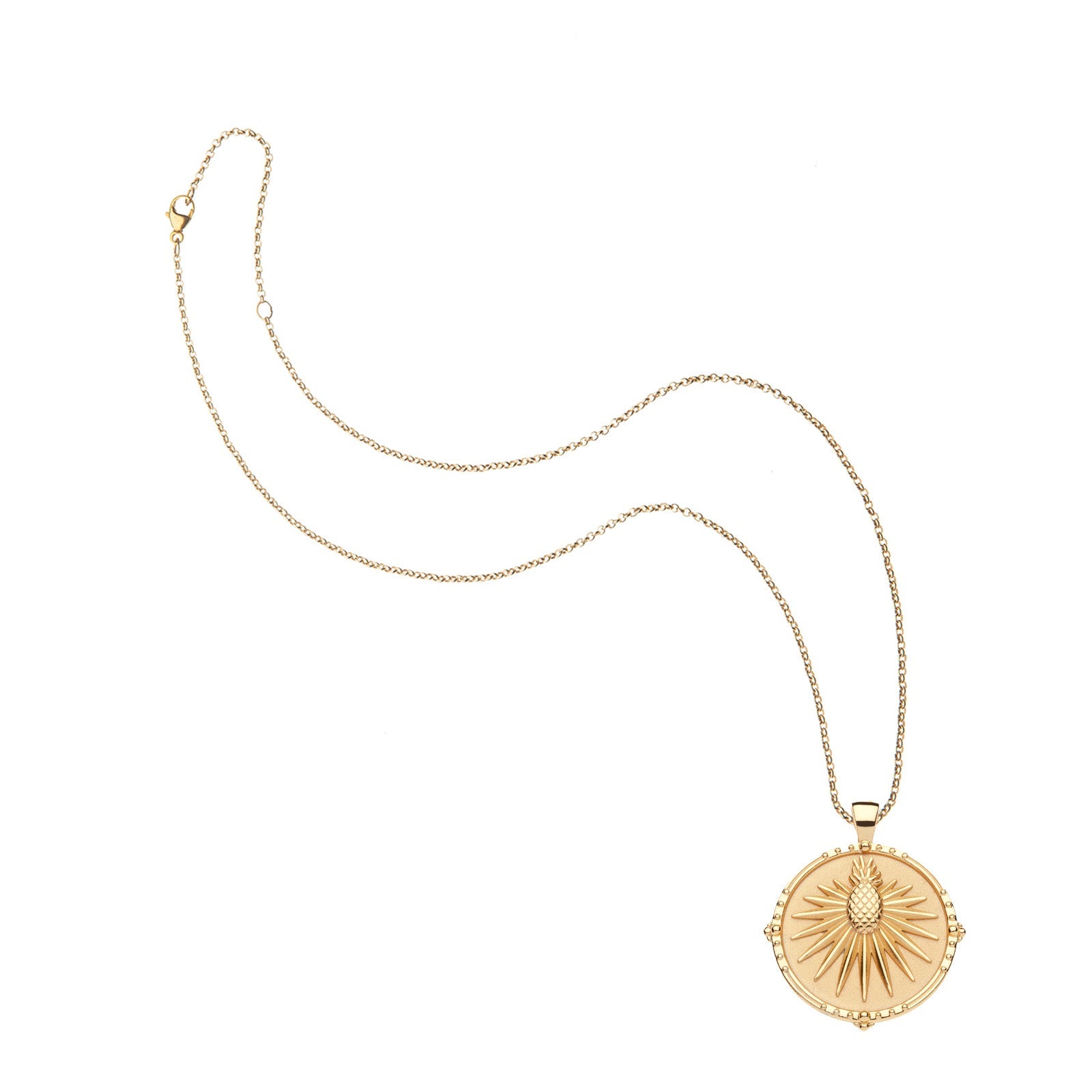 The Jane Win Destination Pendant Necklace Collection features a gold coin pendant with a round sunburst design and central raised motif, shown on a white background—ideal for fans of unique necklaces.