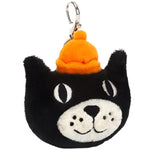 The Jellycat Bag Charm by Jellycat features a soft textured fur keychain shaped like a black cat's head wearing an orange hat, complete with a silver claw clip for easy attachment.