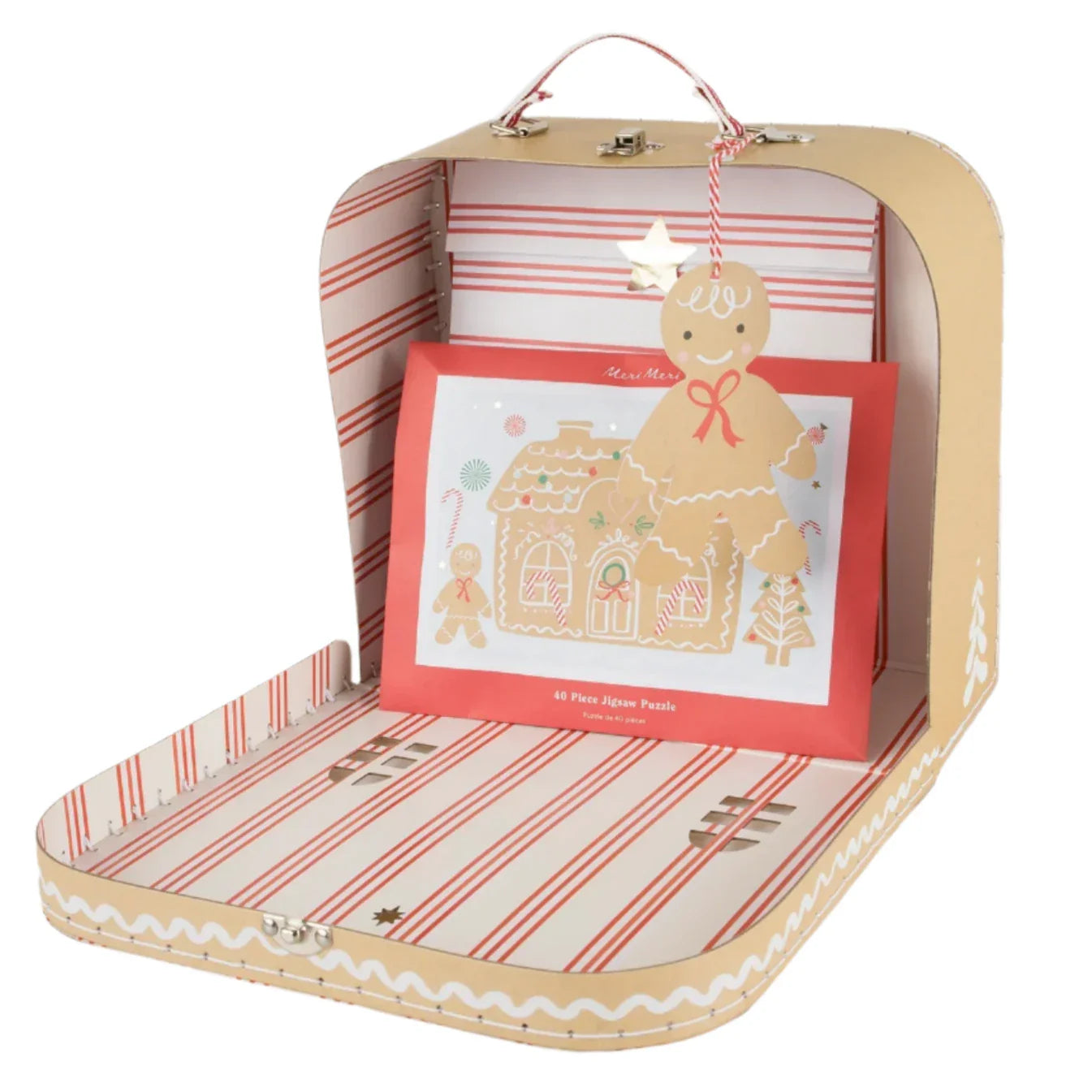 The Meri Meri Gingerbread Christmas Eve Suitcase by Meri Meri is a festive suitcase-style box that opens to reveal an interactive gift: it features a red puzzle box adorned with gingerbread cookies and a charming gingerbread house design, ideal for a delightful Christmas Eve surprise.