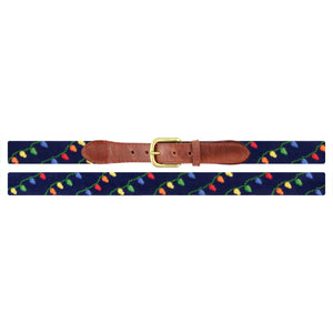 The Smathers & Branson Christmas Lights Belt features navy hand-stitching, a brown Italian leather buckle section, and a festive pattern of colorful string lights.