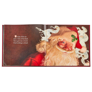 The Night Before Christmas Leather Book by Graphic Image features Charles Santore-inspired art of Santa with rosy cheeks and swirling smoke, plus a poem celebrating his charm—perfect for fans of this beloved holiday classic.