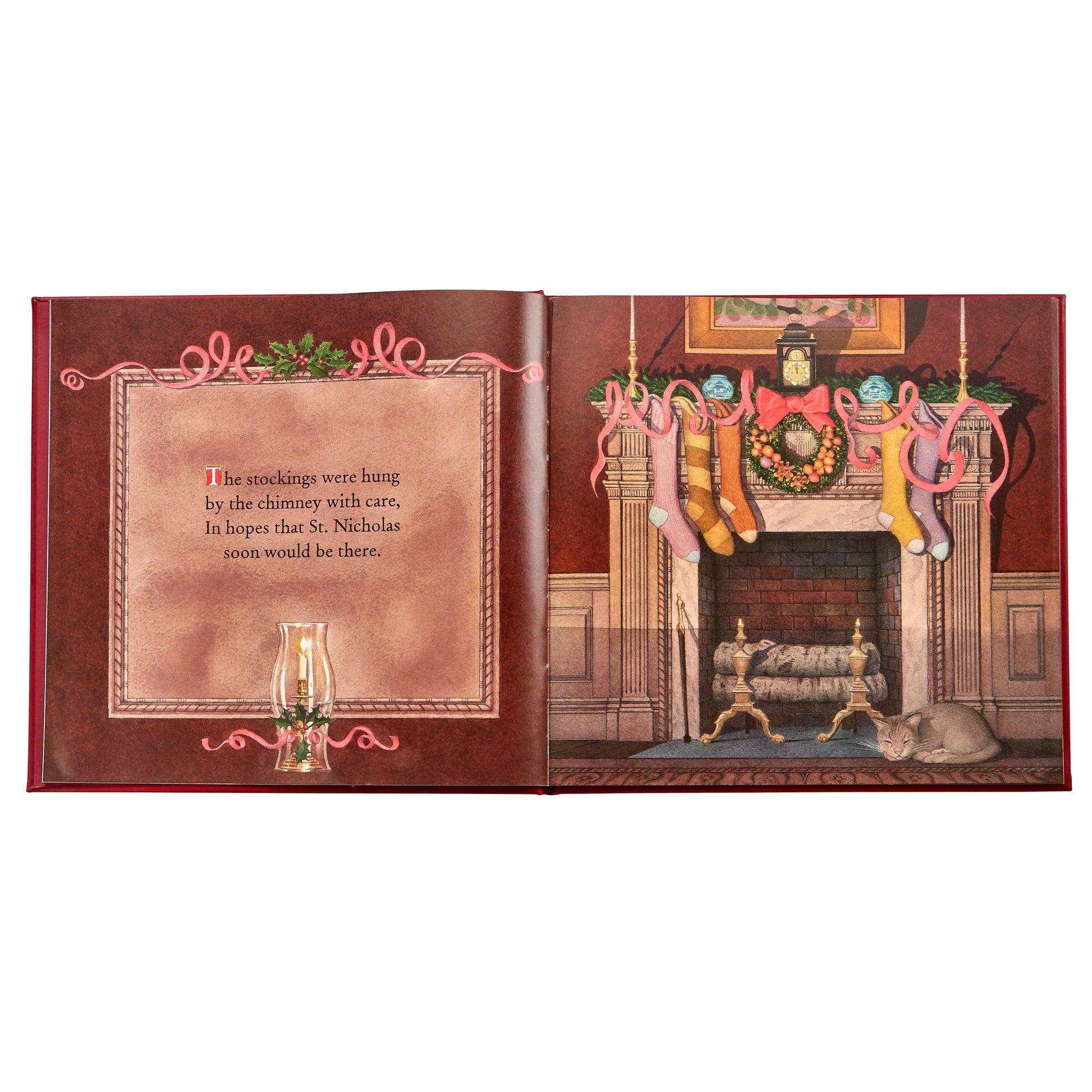 The Night Before Christmas Leather Book by Graphic Image features Charles Santore's illustrations of stockings on a fireplace with a clock and ornaments above, plus a sleeping cat—perfectly capturing the St. Nicholas tradition.